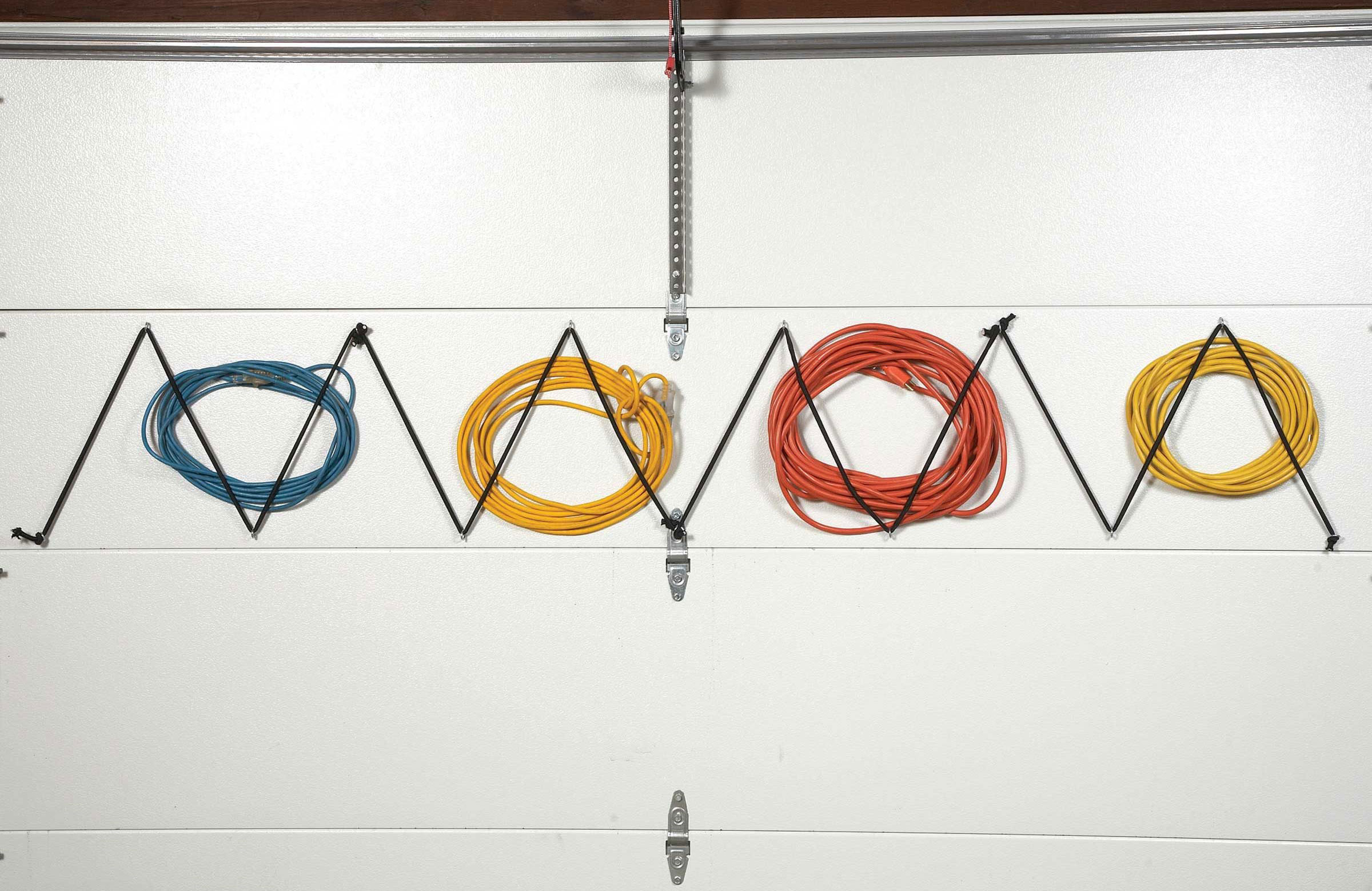 Garage door extension cord storage